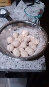 After resting, shape dough into smaller balls.
